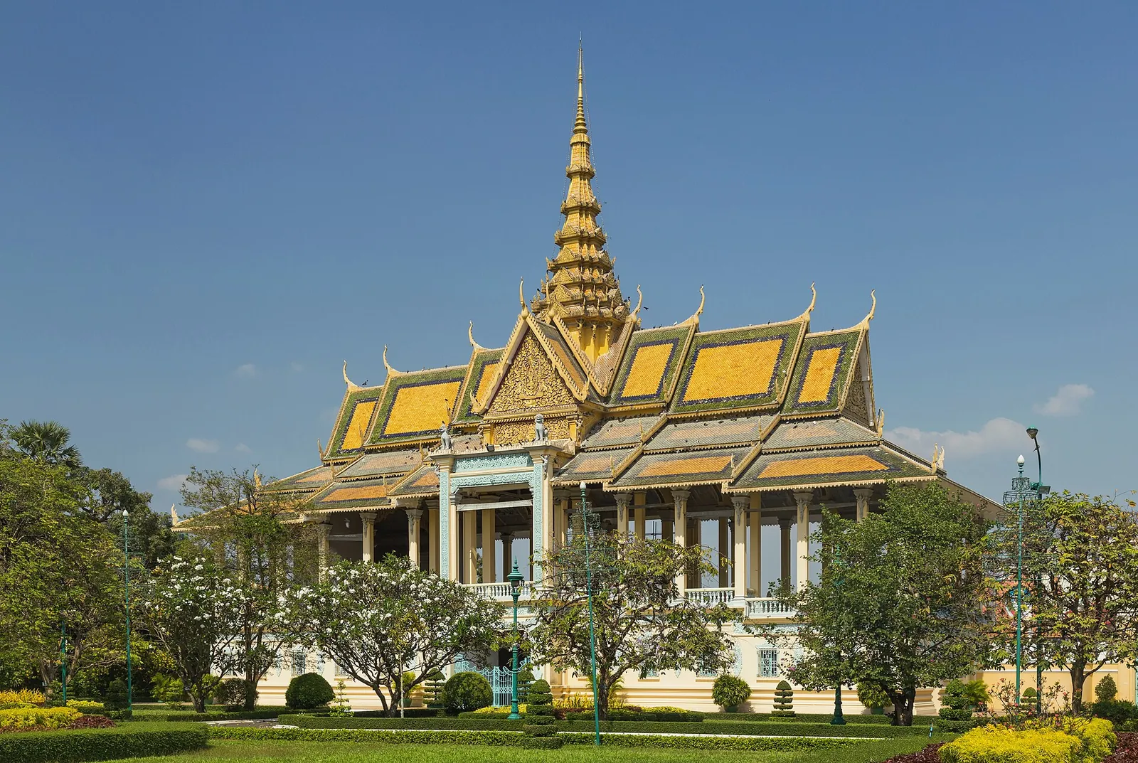 Golden spire and tiered roofs of a pavilion at the Royal Palace in Phnom Penh
