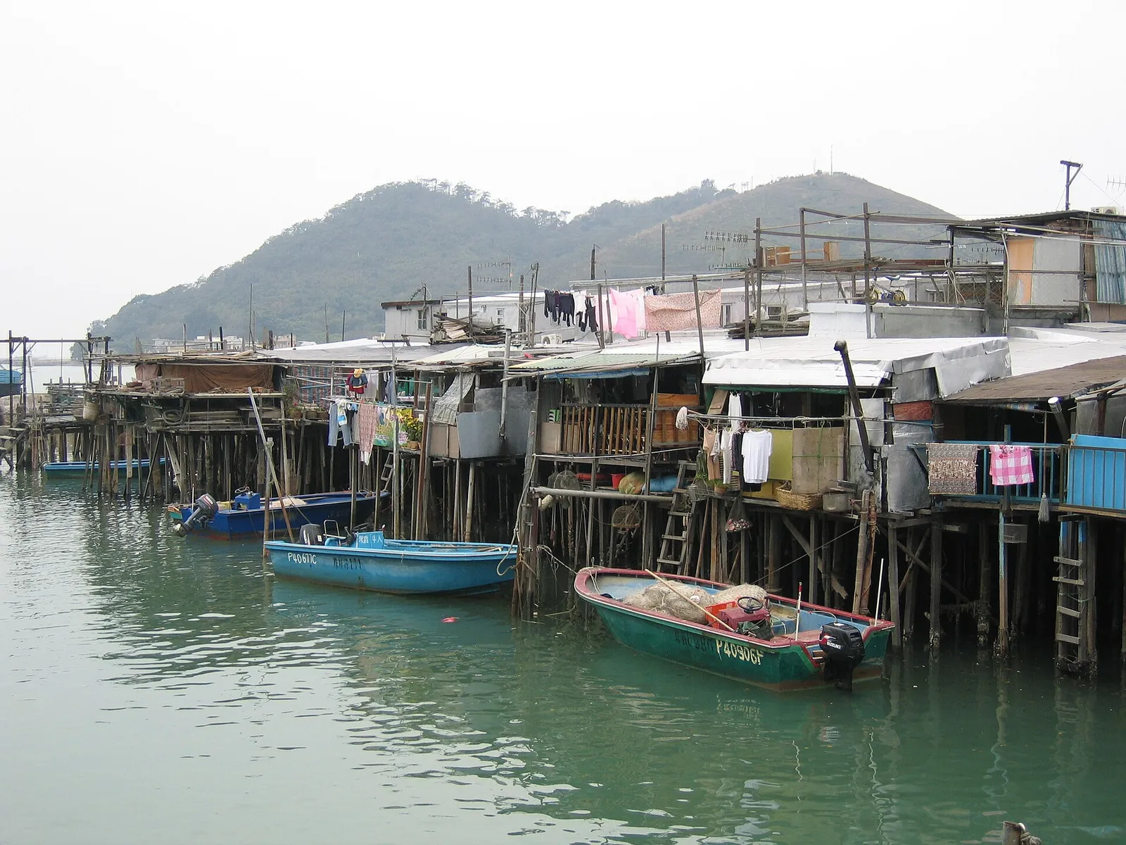 Stilt houses and small boats along the creek at Tai O