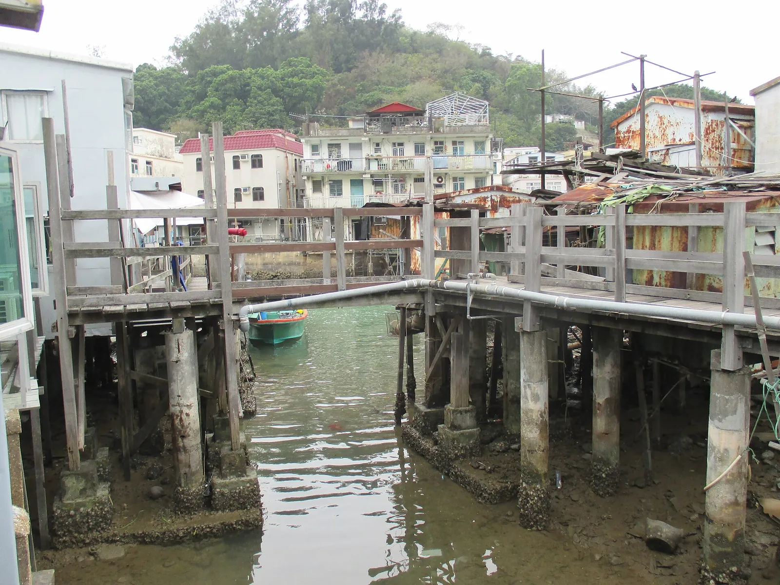 Tai O homes standing on piles beside a footbridge