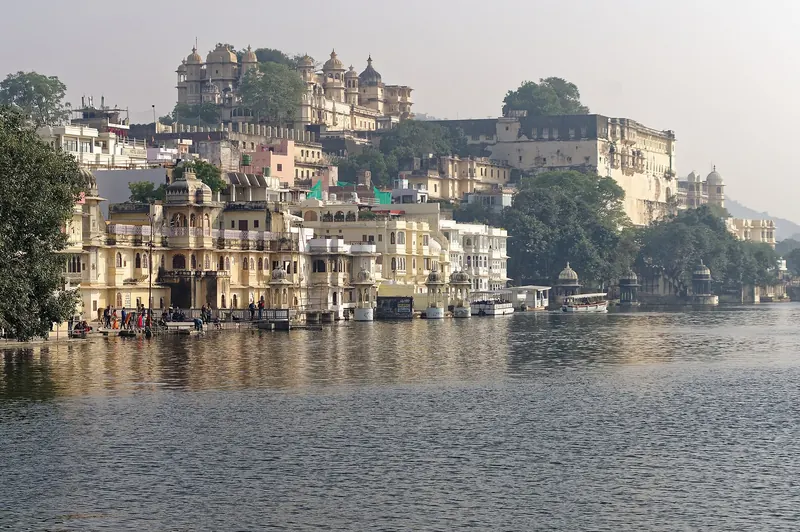 The City Palace of Udaipur rising above the shore of Lake Pichola