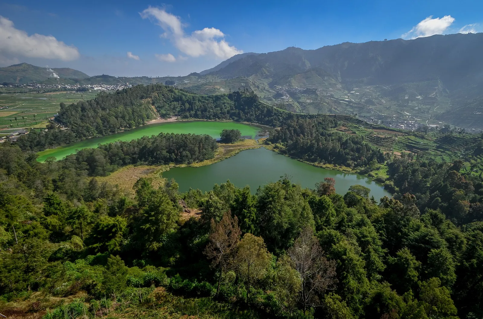 Telaga Warna and Telaga Pengilon lakes seen from above among forest and hills, Dieng Plateau