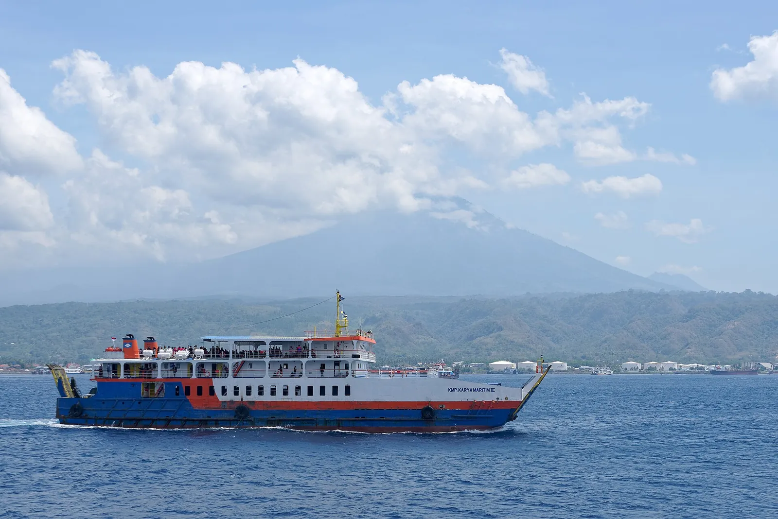 Ferry crossing the Bali Strait from Ketapang in East Java towards Gilimanuk, with a volcano behind