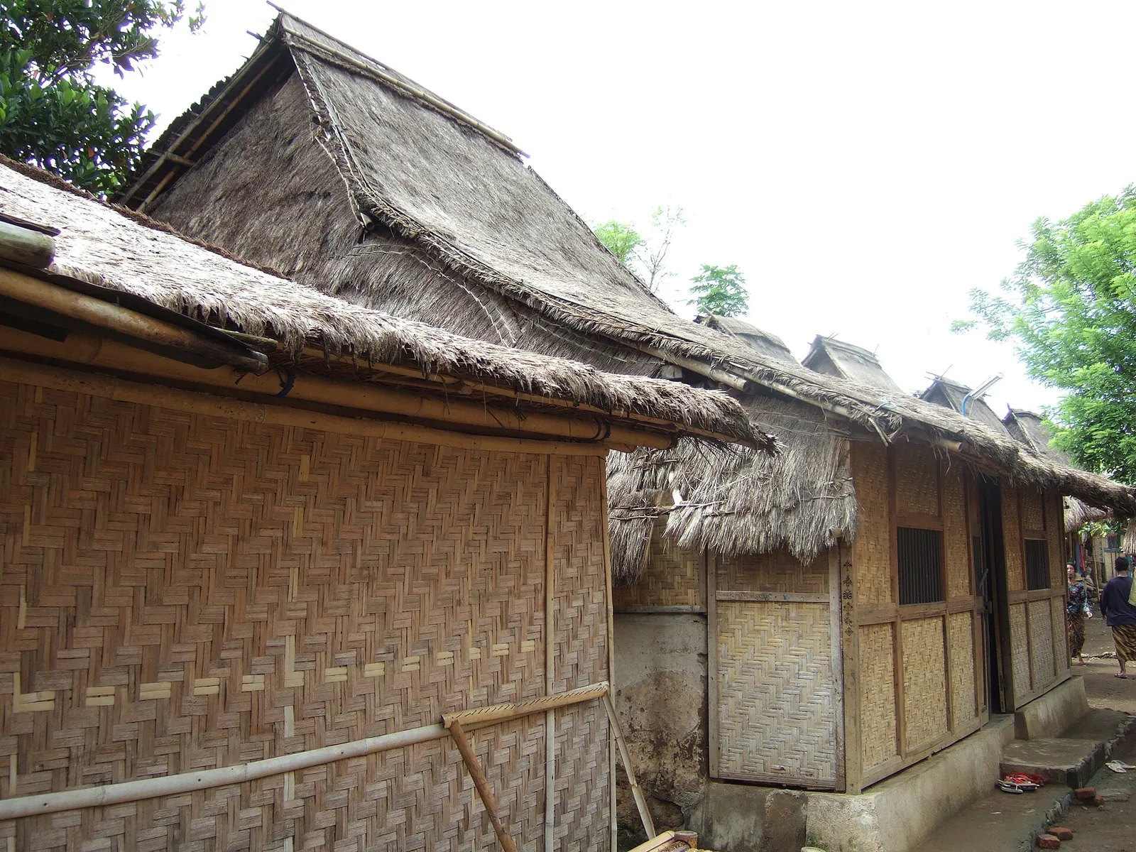 Thatched Sasak houses with woven bamboo walls in Sade village, Central Lombok