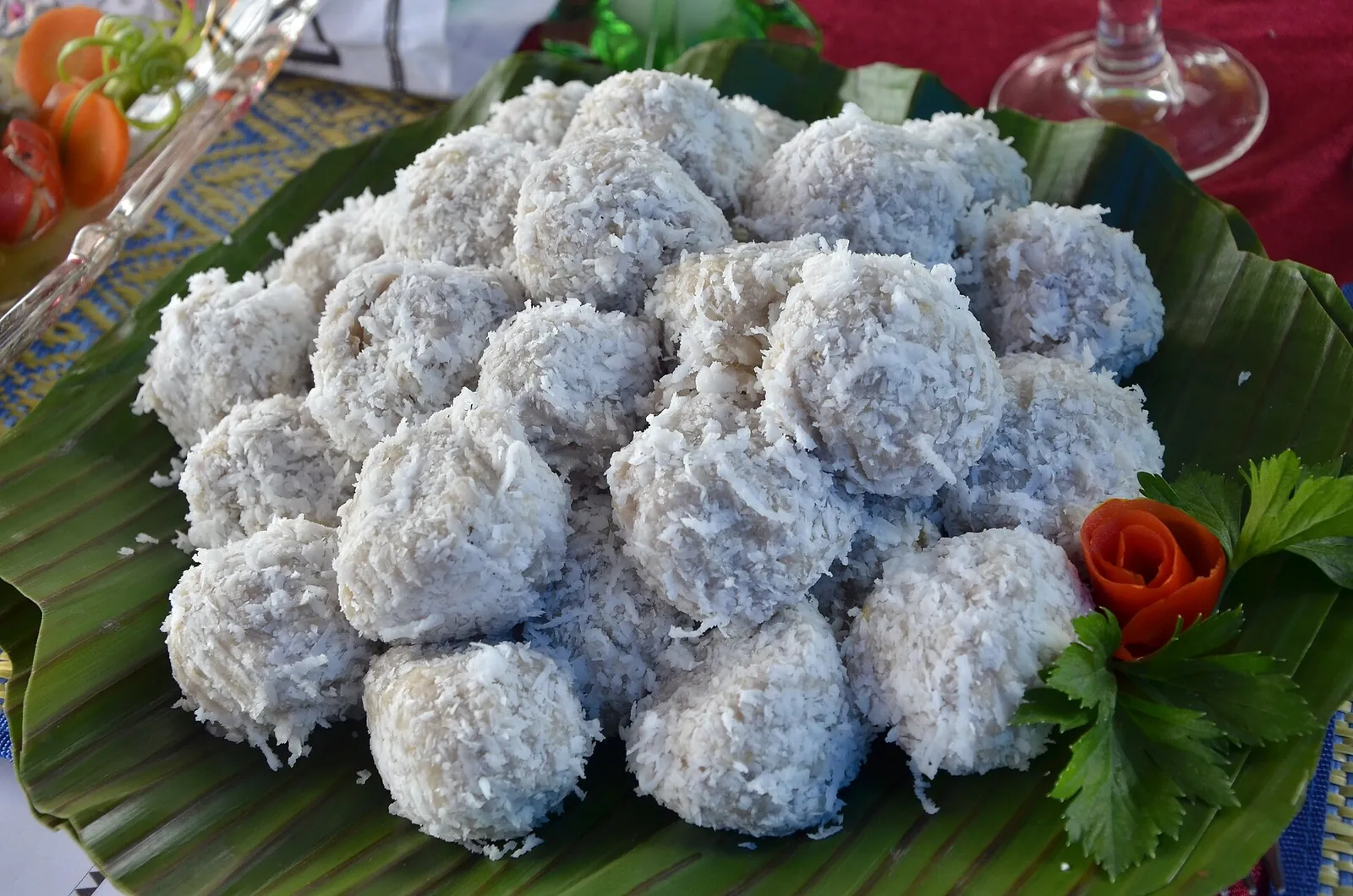 A platter of subbet, balls of taro and banana dough rolled in grated coconut