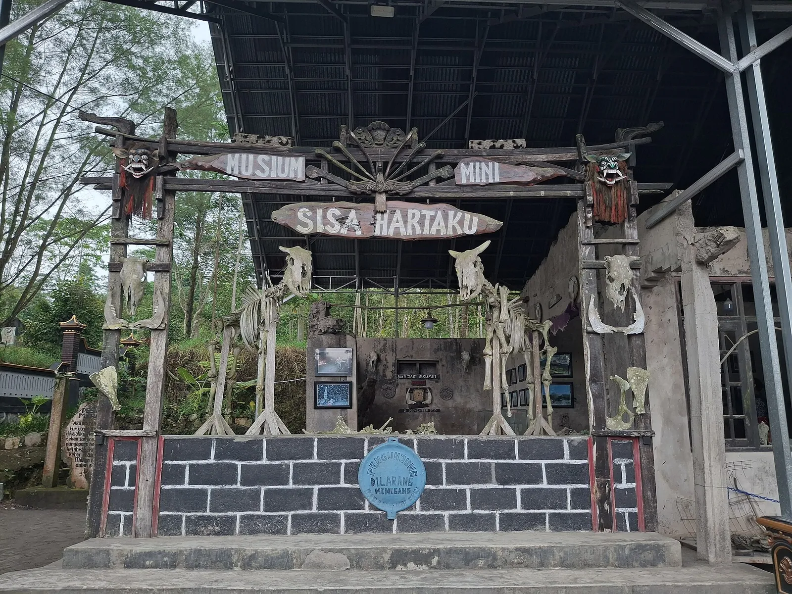 Entrance gate of Museum Mini Sisa Hartaku, decorated with relics recovered after the eruption