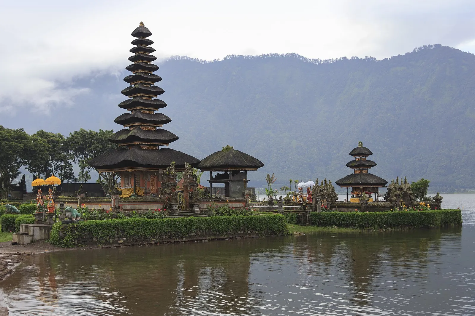 The tiered meru shrines of Pura Ulun Danu Beratan standing at the edge of Lake Beratan under the mountains