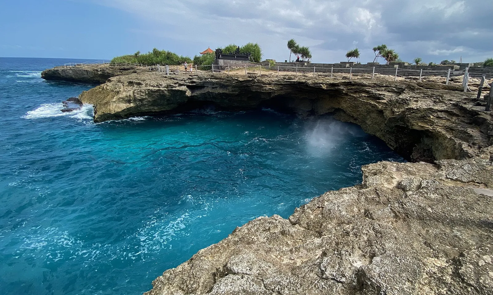 Waves surging into the rocky inlet at Devil's Tear on Nusa Lembongan