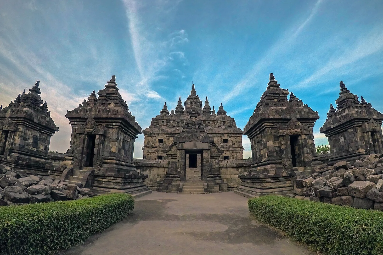 Candi Plaosan's main temple framed by smaller shrines and clipped hedges