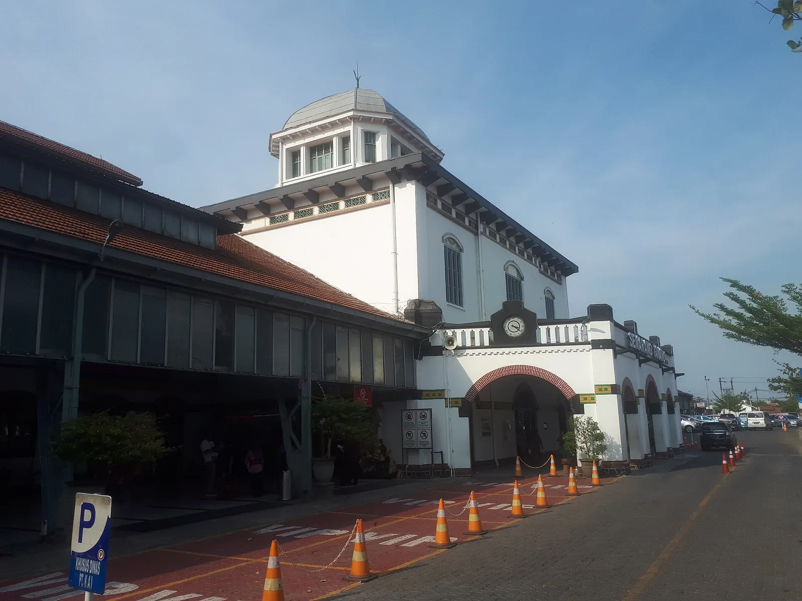 Front of Semarang Tawang railway station with its domed central tower in late afternoon light