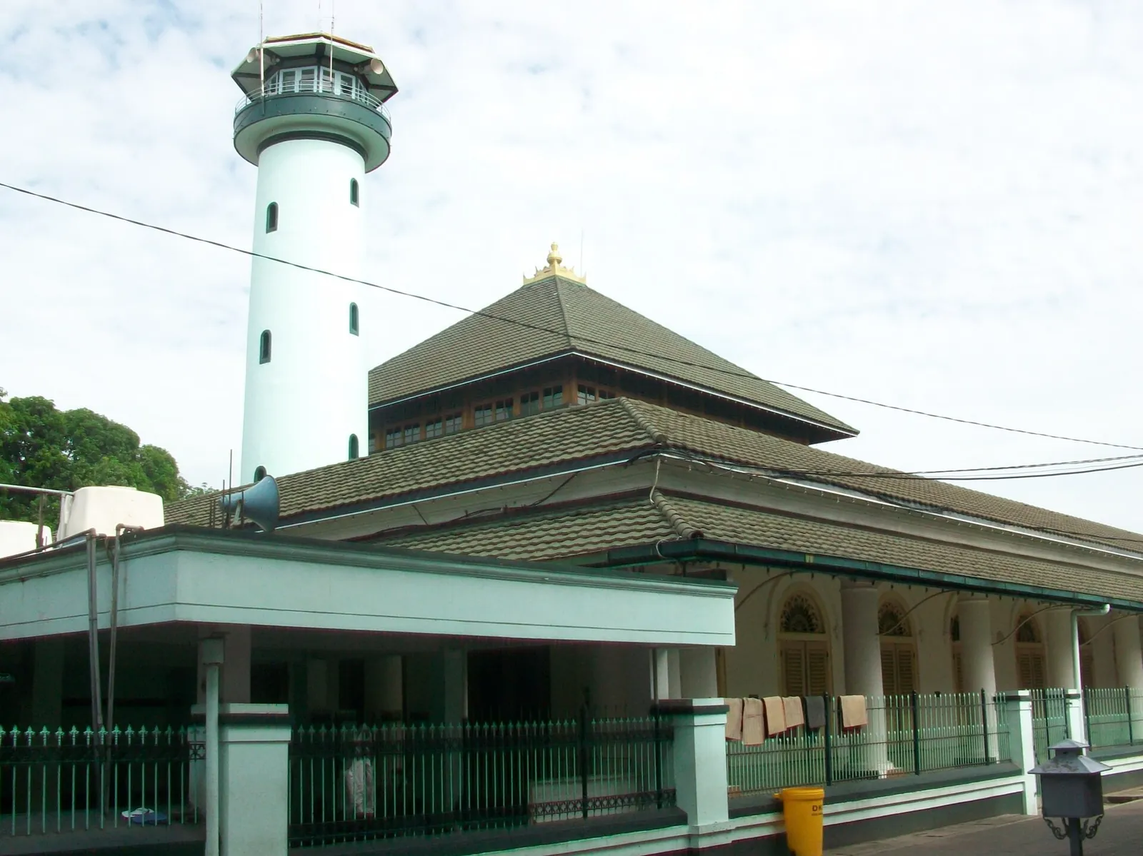 The white minaret and tiered roofs of the Ampel Mosque in Surabaya's Arab quarter