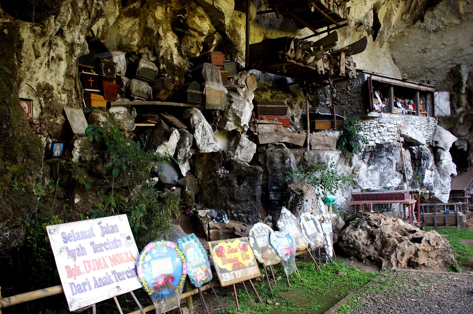 Coffins and burial offerings at the foot of the rock face at the Londa burial cave, Tana Toraja