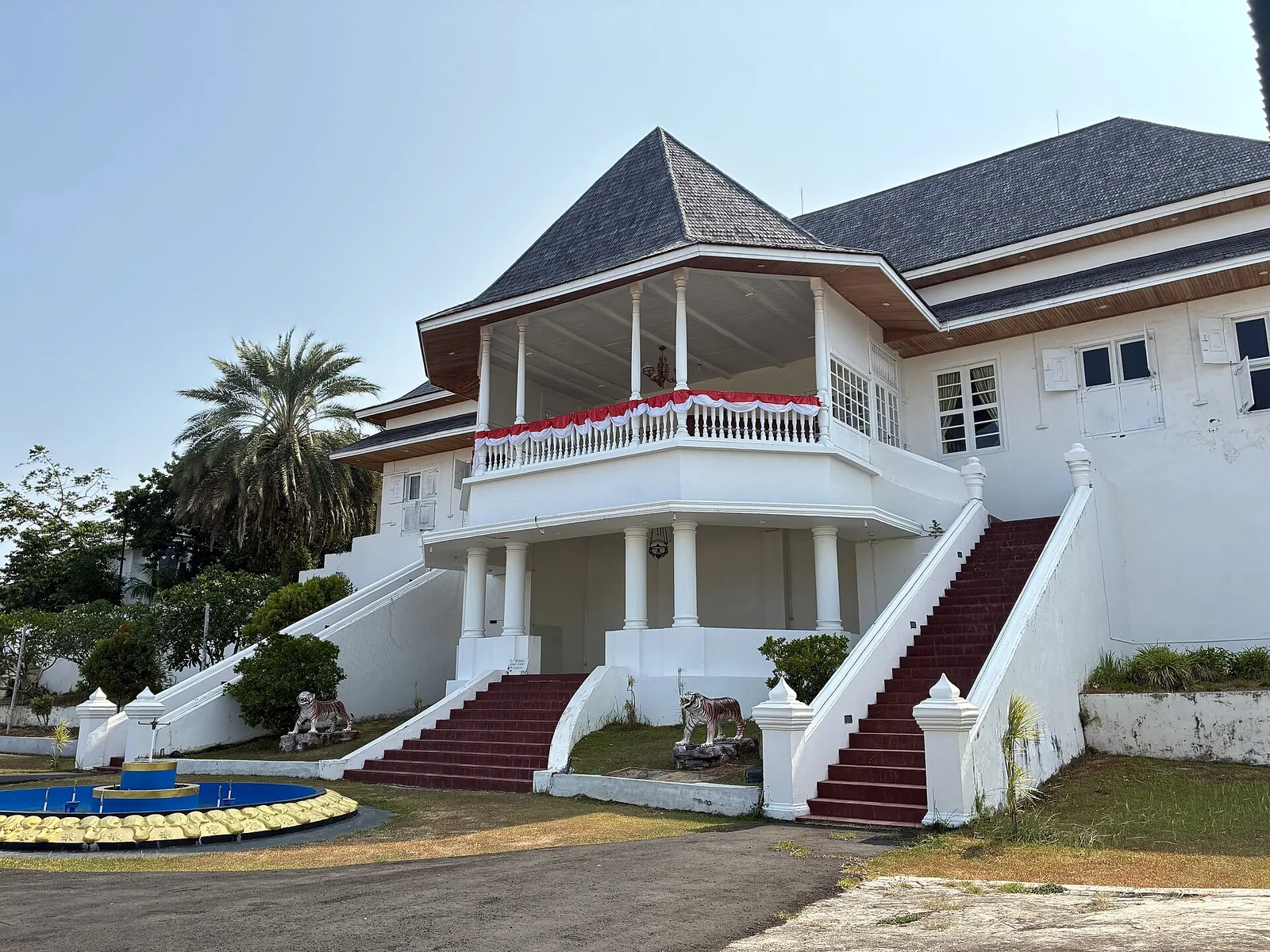 The white Kedaton of the Sultanate of Ternate with its octagonal veranda and twin red-carpeted staircases