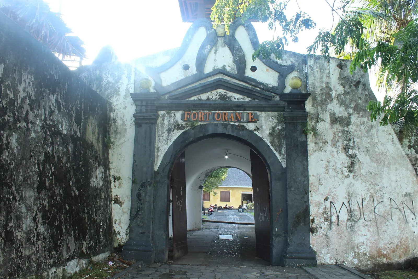 The arched stone gateway of Fort Oranje in Ternate with the fort's name above the entrance