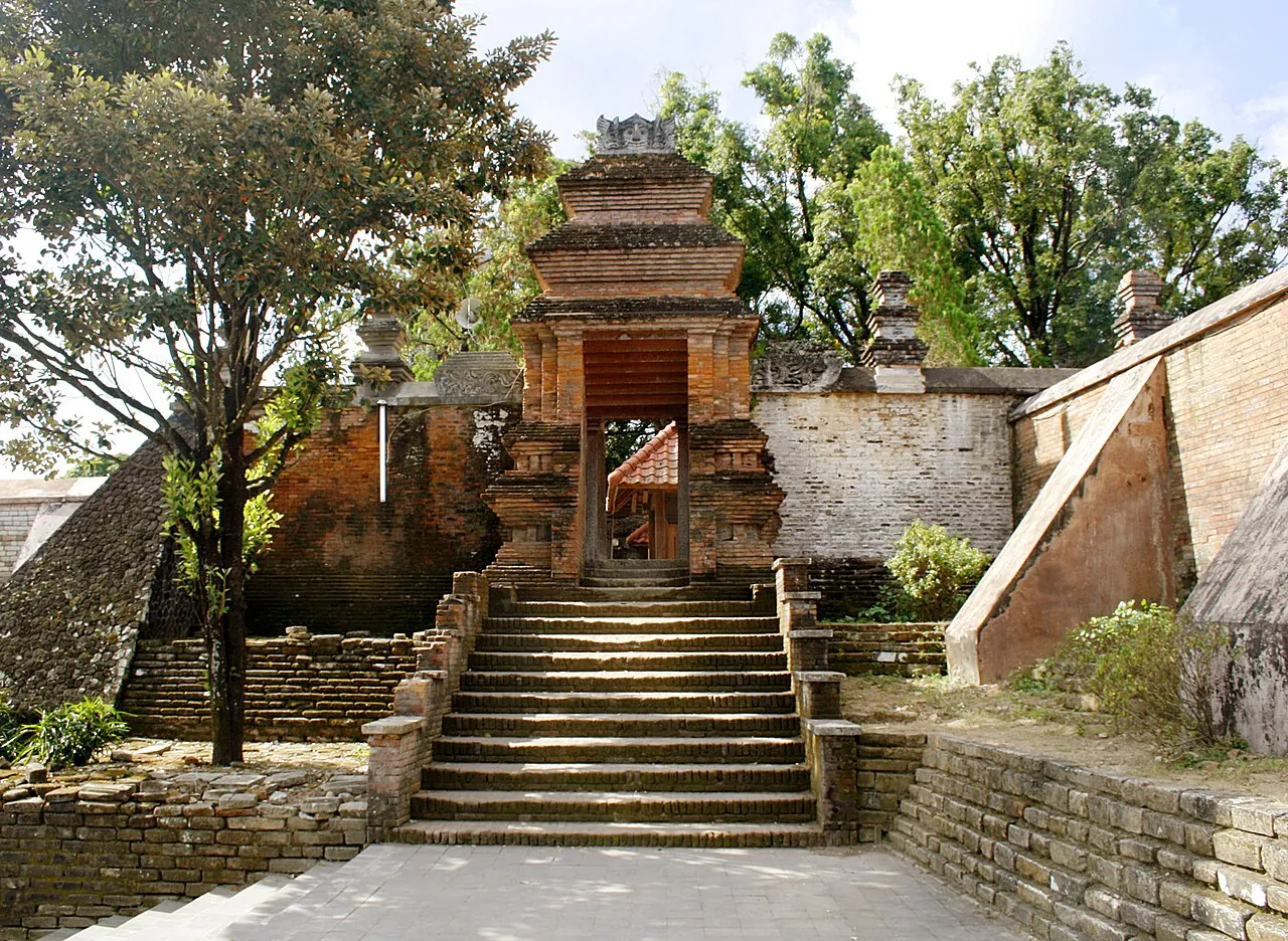 Brick gateway and stone steps among trees in Kotagede, Yogyakarta