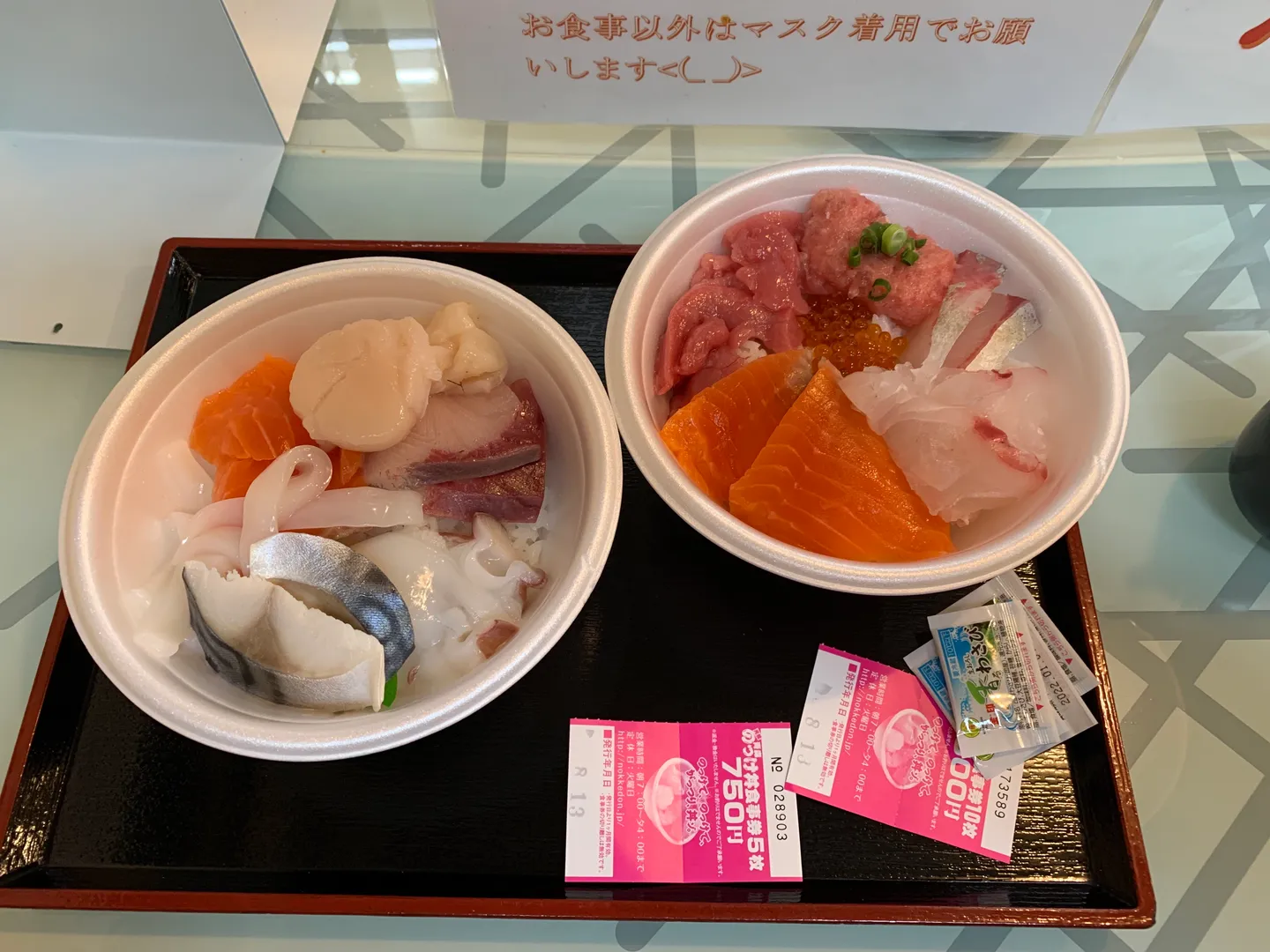Nokke-don rice bowls topped with seafood at Aomori's market.