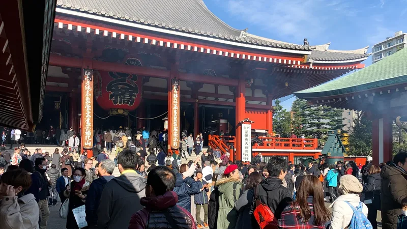 Visitors outside Sensoji in Asakusa, Tokyo.