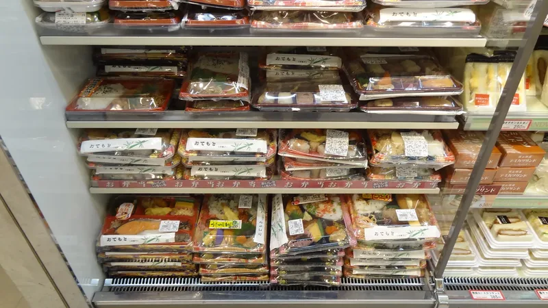 Packaged bento meals for sale in a Japanese convenience store.