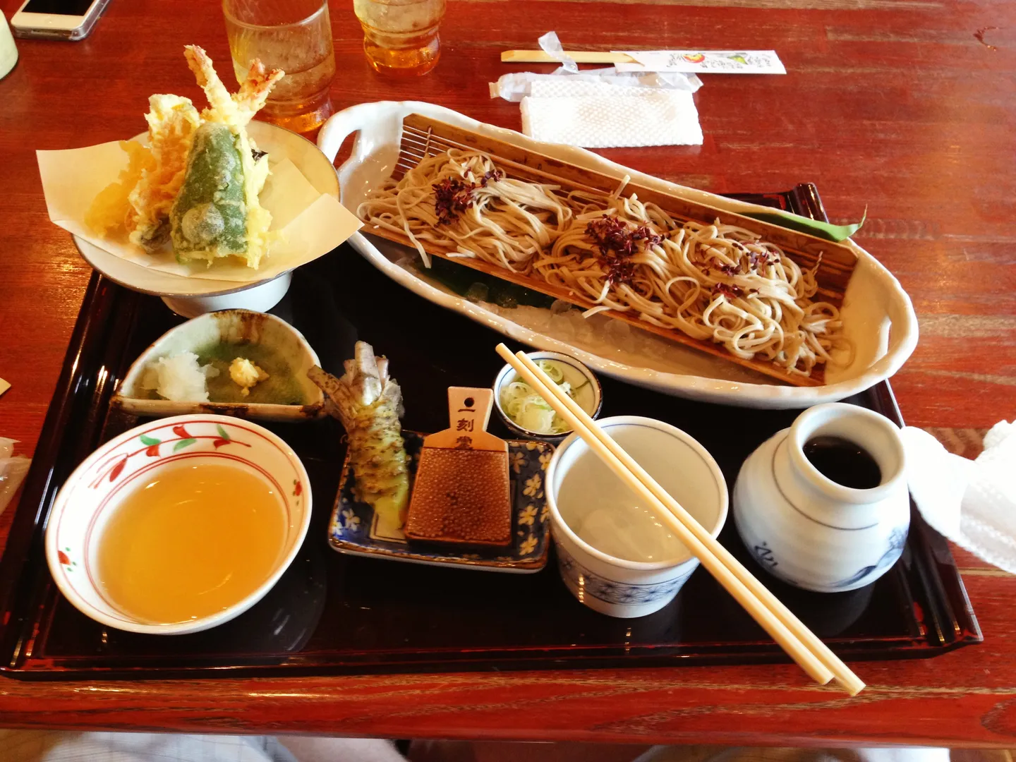 Soba noodles, tempura and side dishes photographed in Japan.