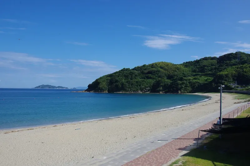Takahama Beach on Fukue Island, with sand, blue water and a coastal headland.