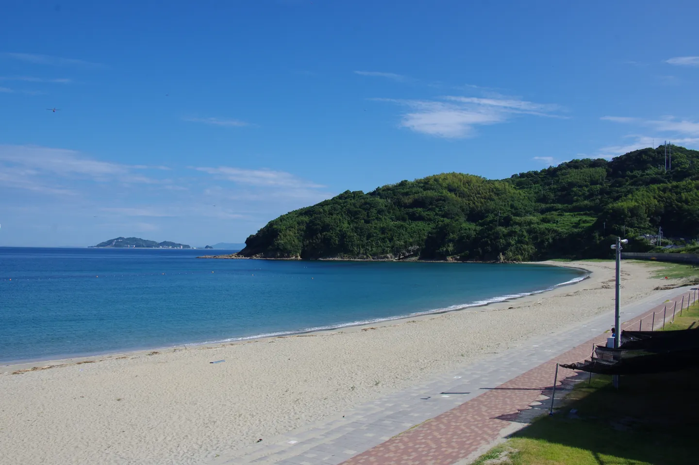 Takahama Beach on Fukue Island, with sand, blue water and a coastal headland.