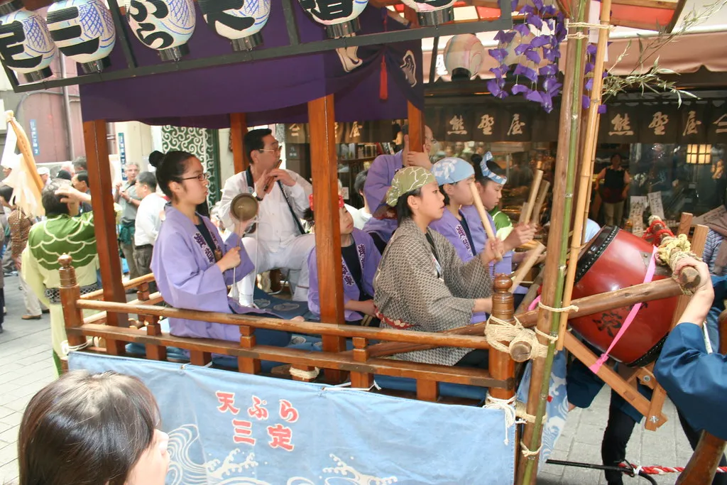 A festival float and visitors in Asakusa, Tokyo.