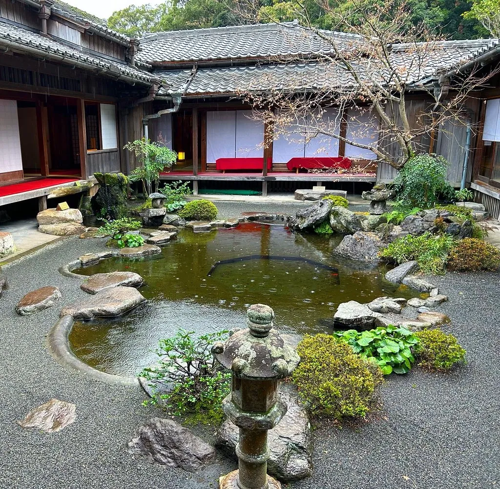 A pond, rocks and trees in Sengan-en Garden in Kagoshima.