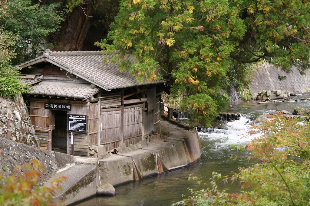 Traditional buildings beside the stream in Kurokawa Onsen.