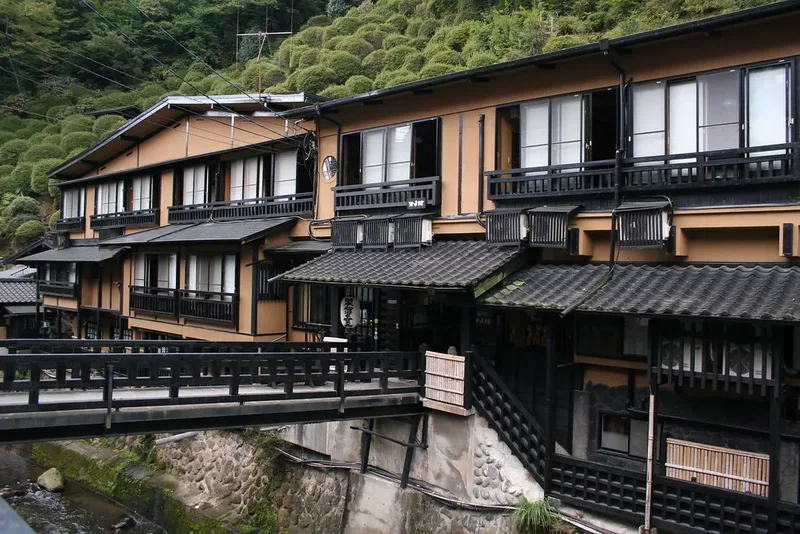 A traditional building beside the stream in Kurokawa Onsen.