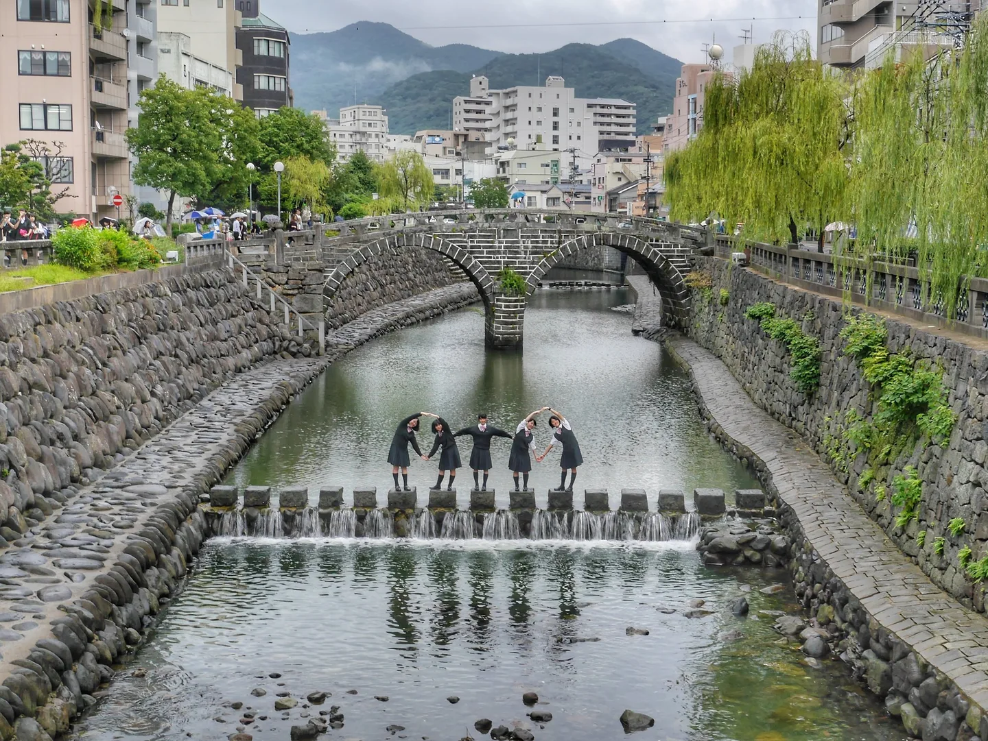 Meganebashi, the two-arched Spectacles Bridge, reflected in the river in Nagasaki.
