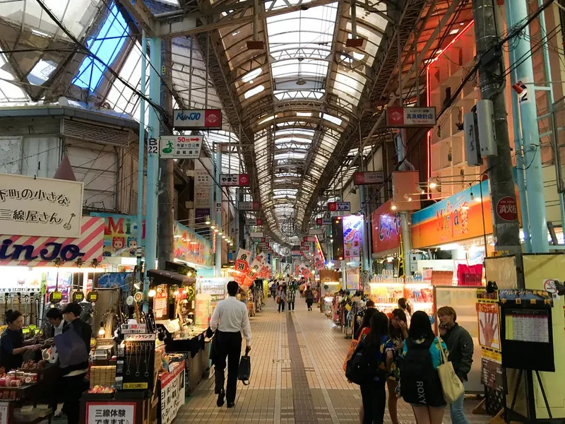 Shops and visitors in the covered Heiwa-dori shopping arcade in Naha.