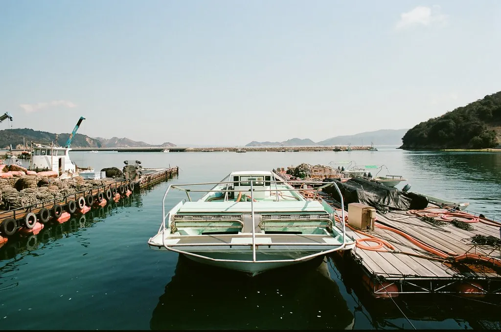 Boats moored at a small harbor on Naoshima.