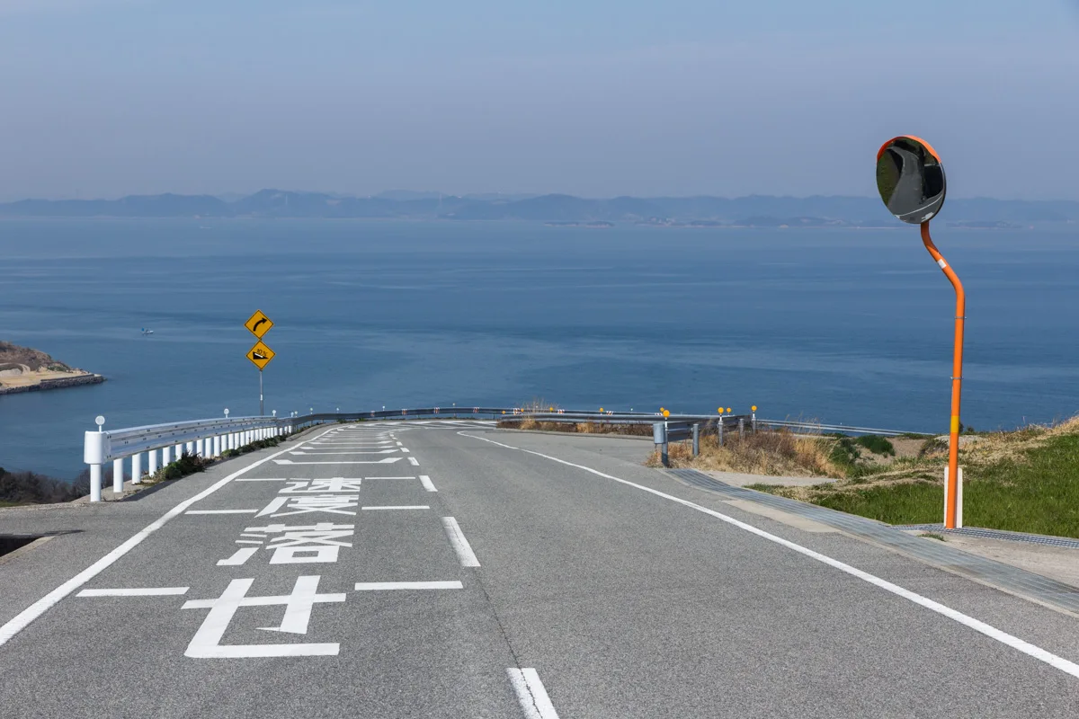 A road descending toward the Seto Inland Sea on Naoshima.