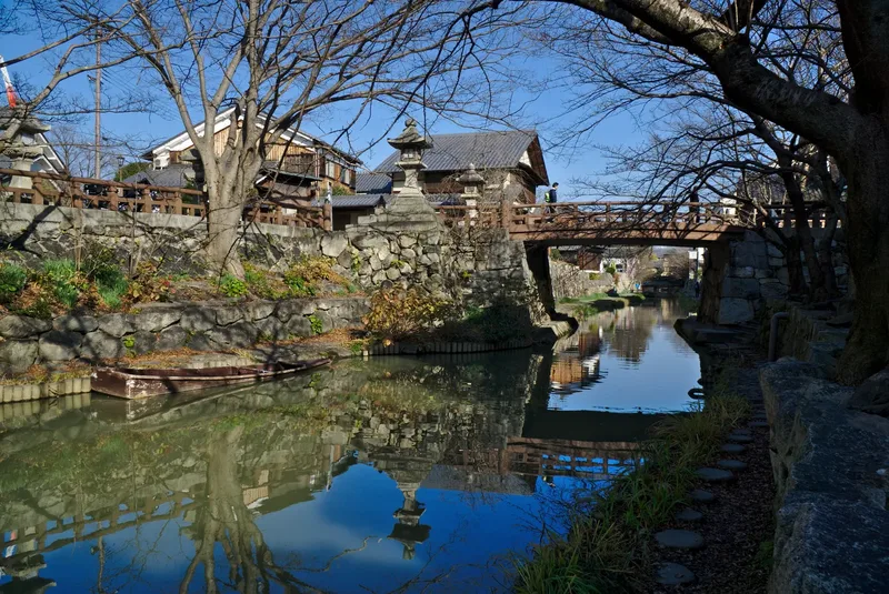 Hachiman-bori canal, a stone bridge and historic buildings in Omihachiman.