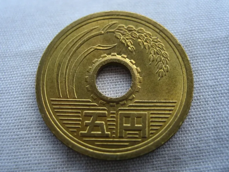 A Japanese five-yen coin.