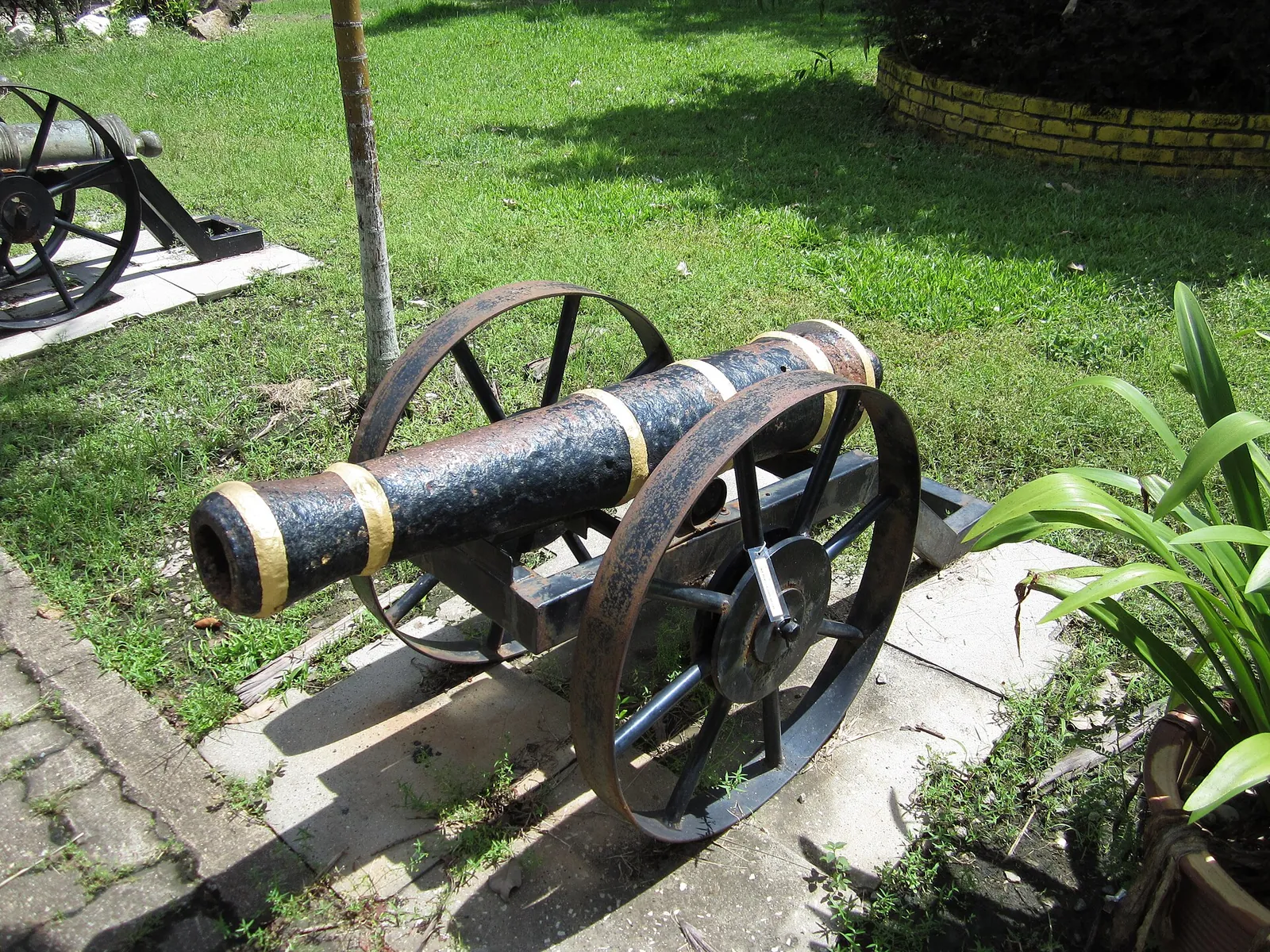 Historic cannon on the grass at the Kedah Royal Museum