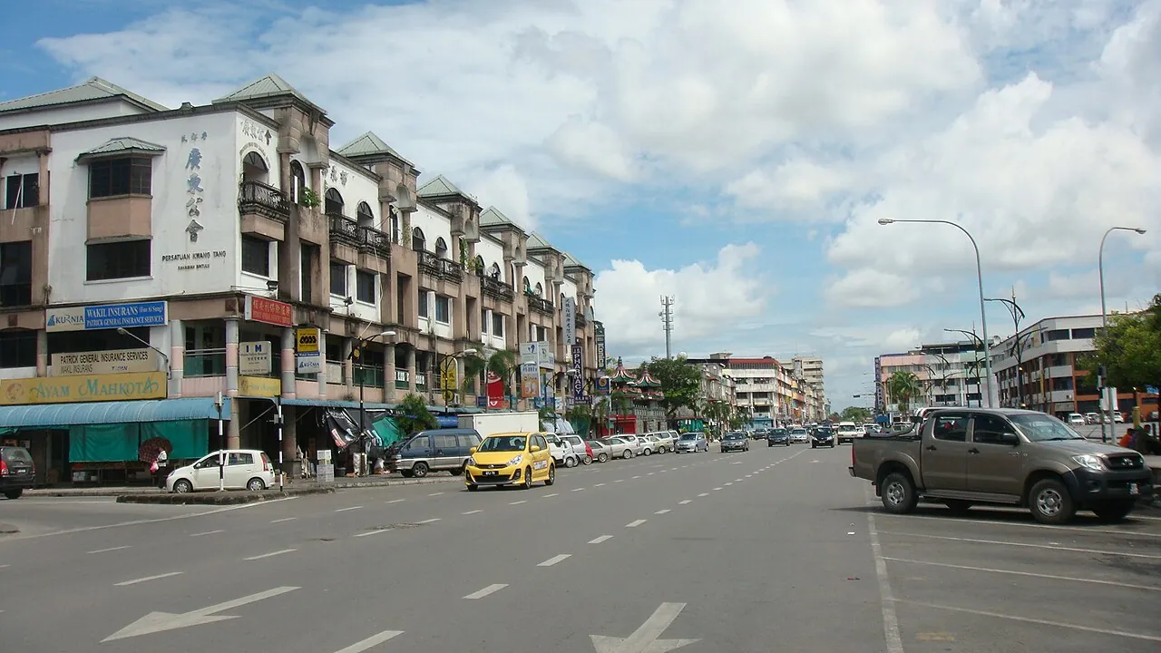 Rows of shophouses and vehicles along Jalan Abang Galau in Bintulu