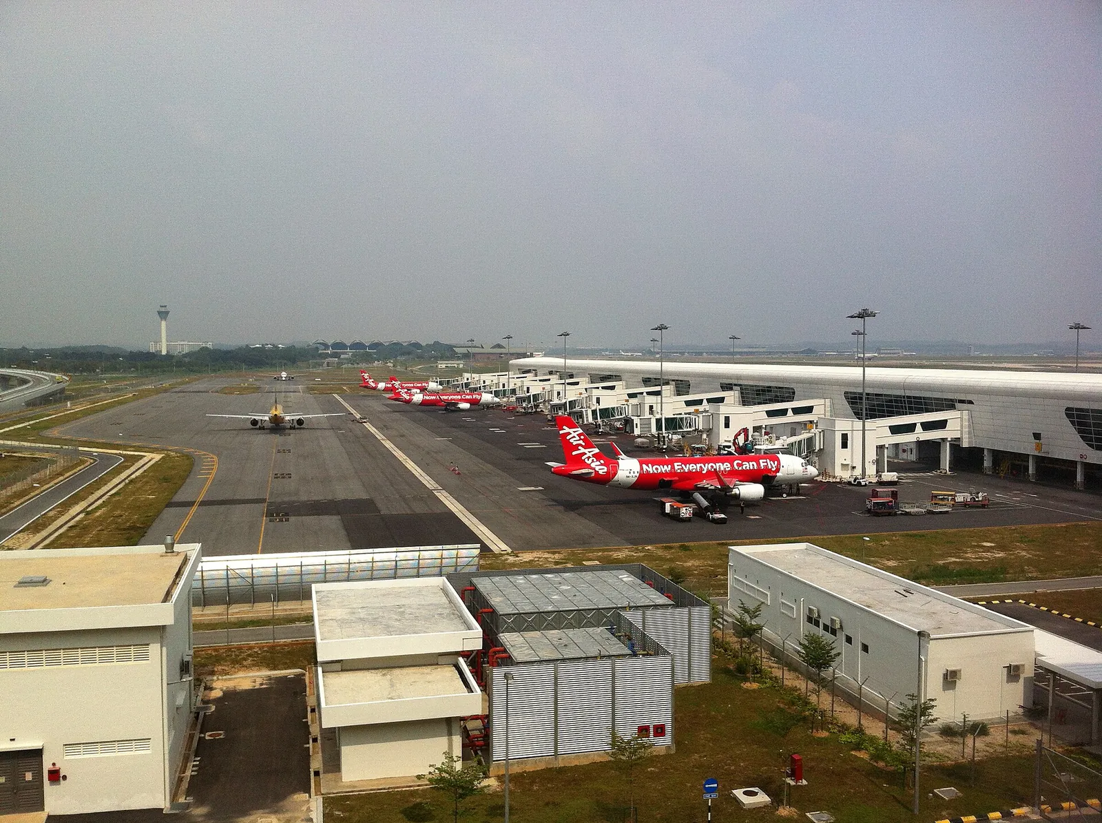 Aircraft parked at gates beside the KLIA2 apron and taxiways