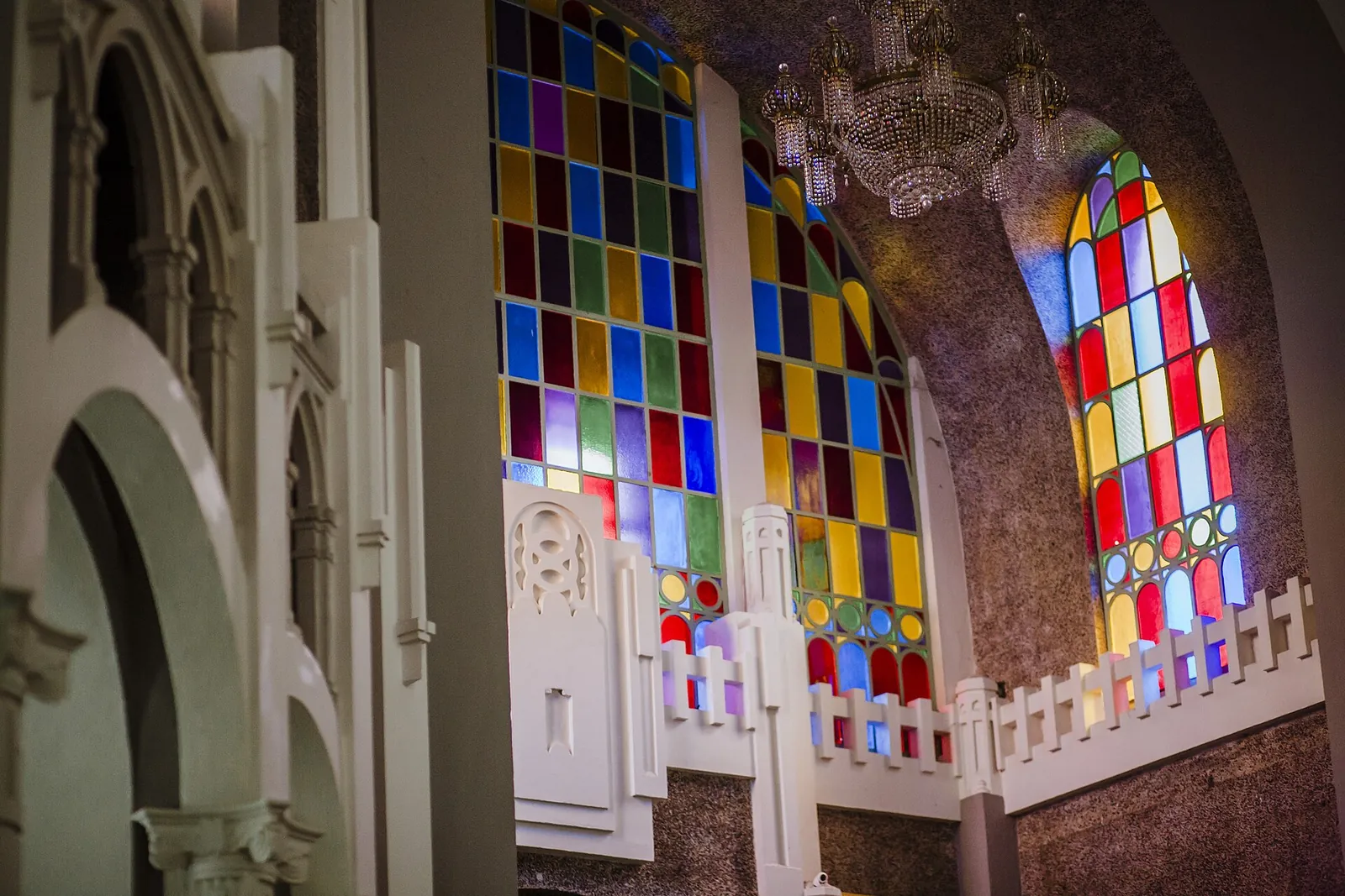 Colorful stained glass and arches inside Sultan Sulaiman Royal Mosque in Klang