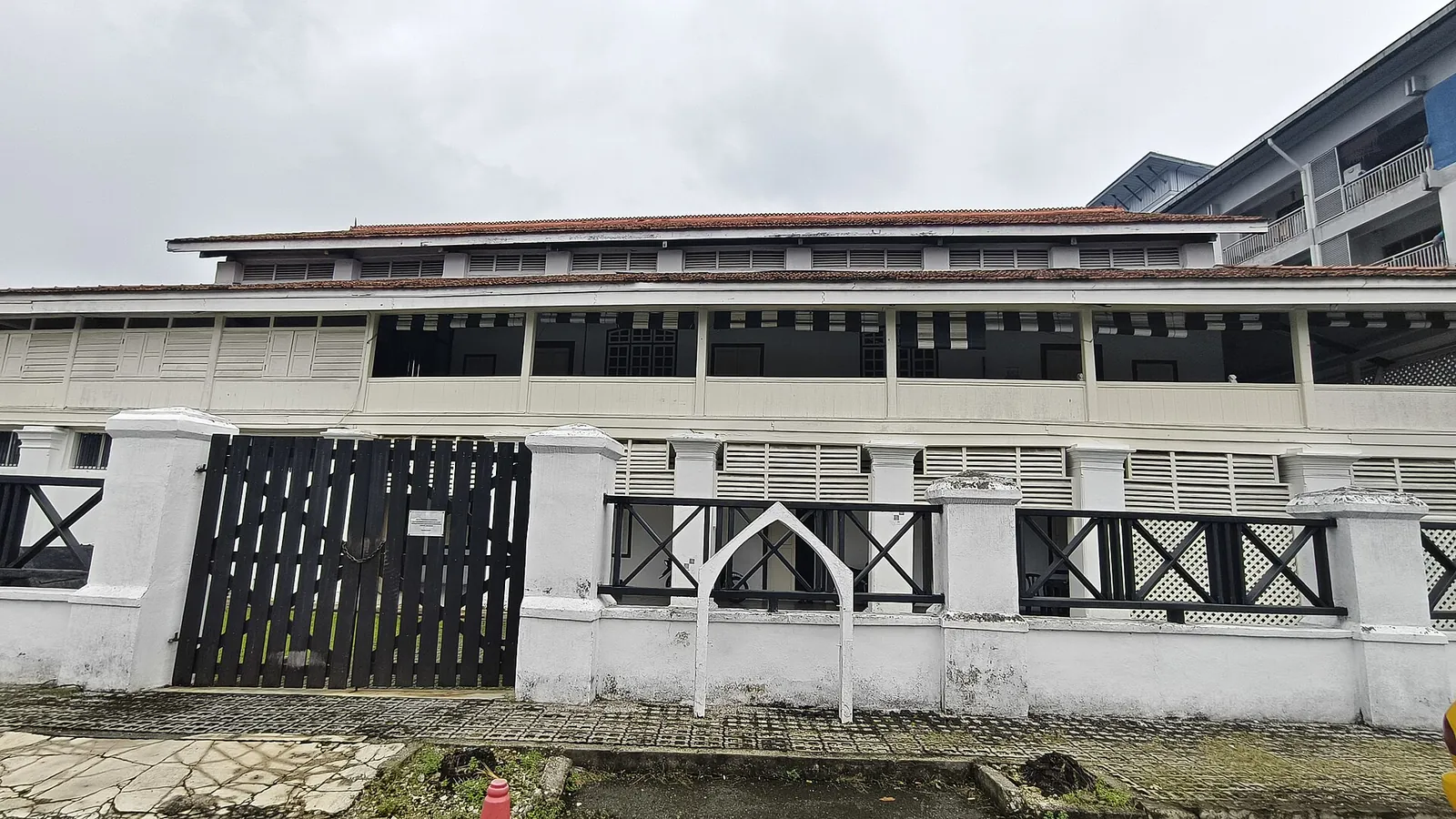 Long white frontage and dark shutters of Gedung Raja Abdullah in Klang