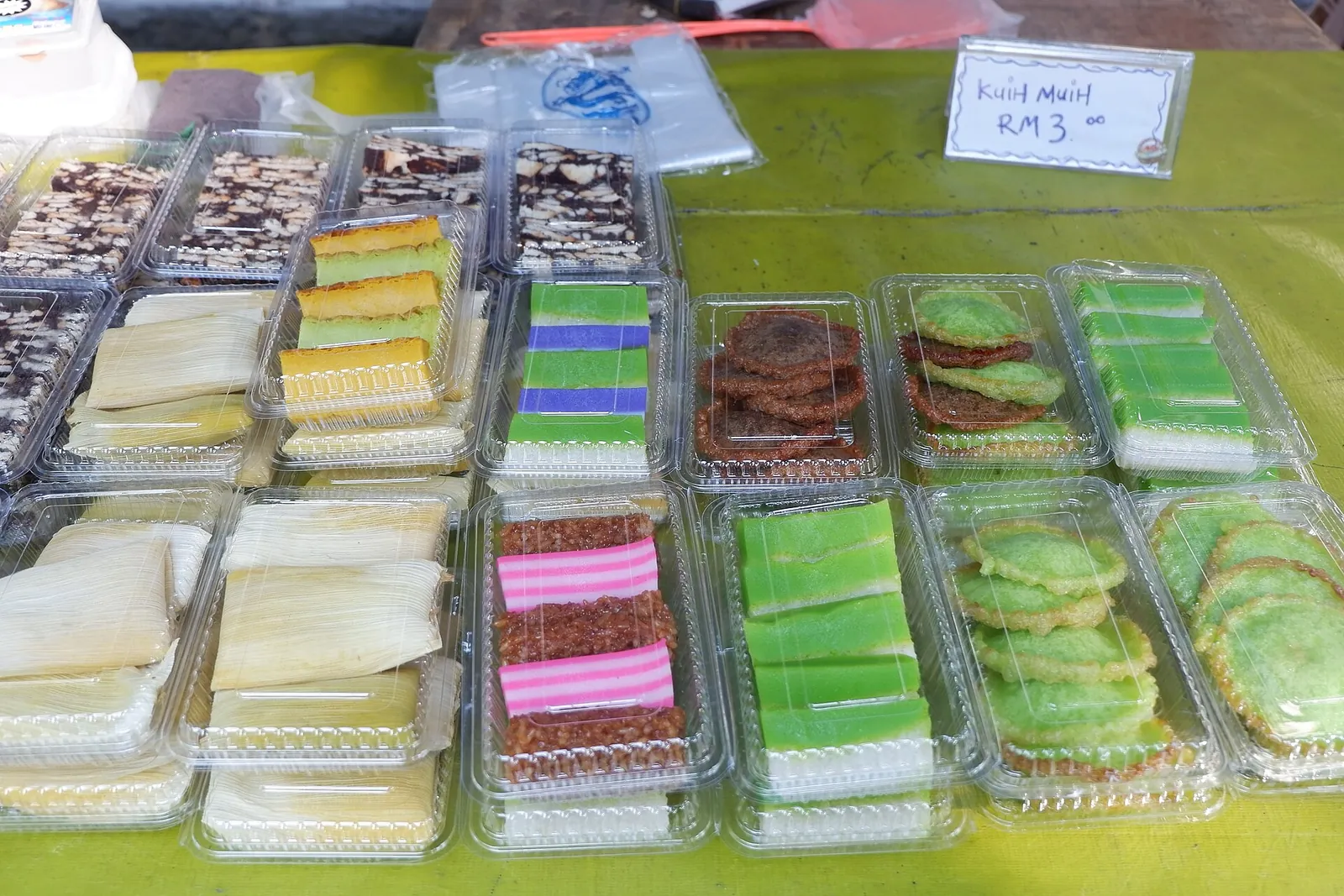 Colorful packaged cakes displayed at Gaya Street Market in Kota Kinabalu
