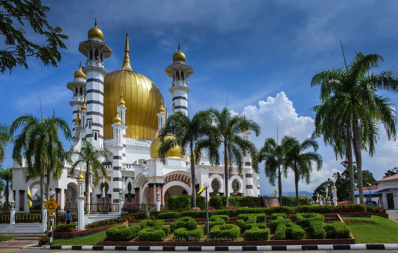Golden domes and white towers of Ubudiah Mosque in Kuala Kangsar