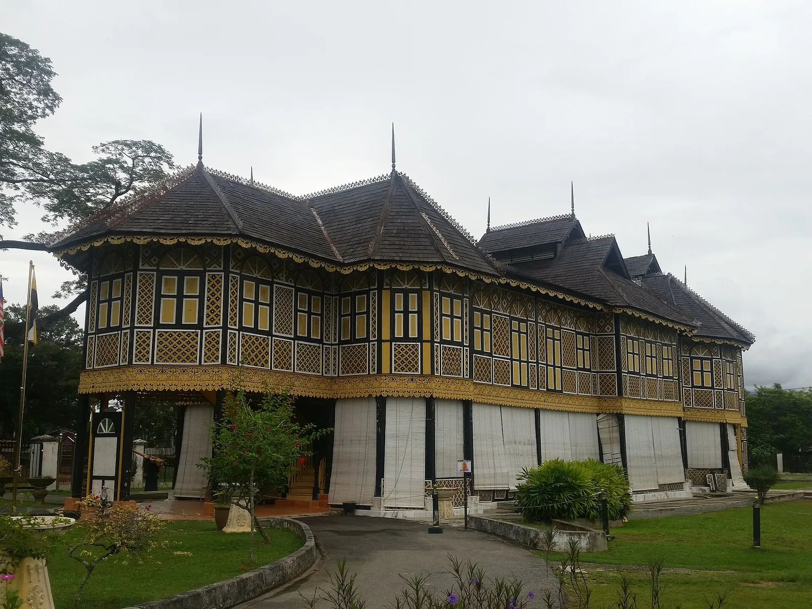 Yellow-and-black timber exterior of Istana Kenangan in Kuala Kangsar