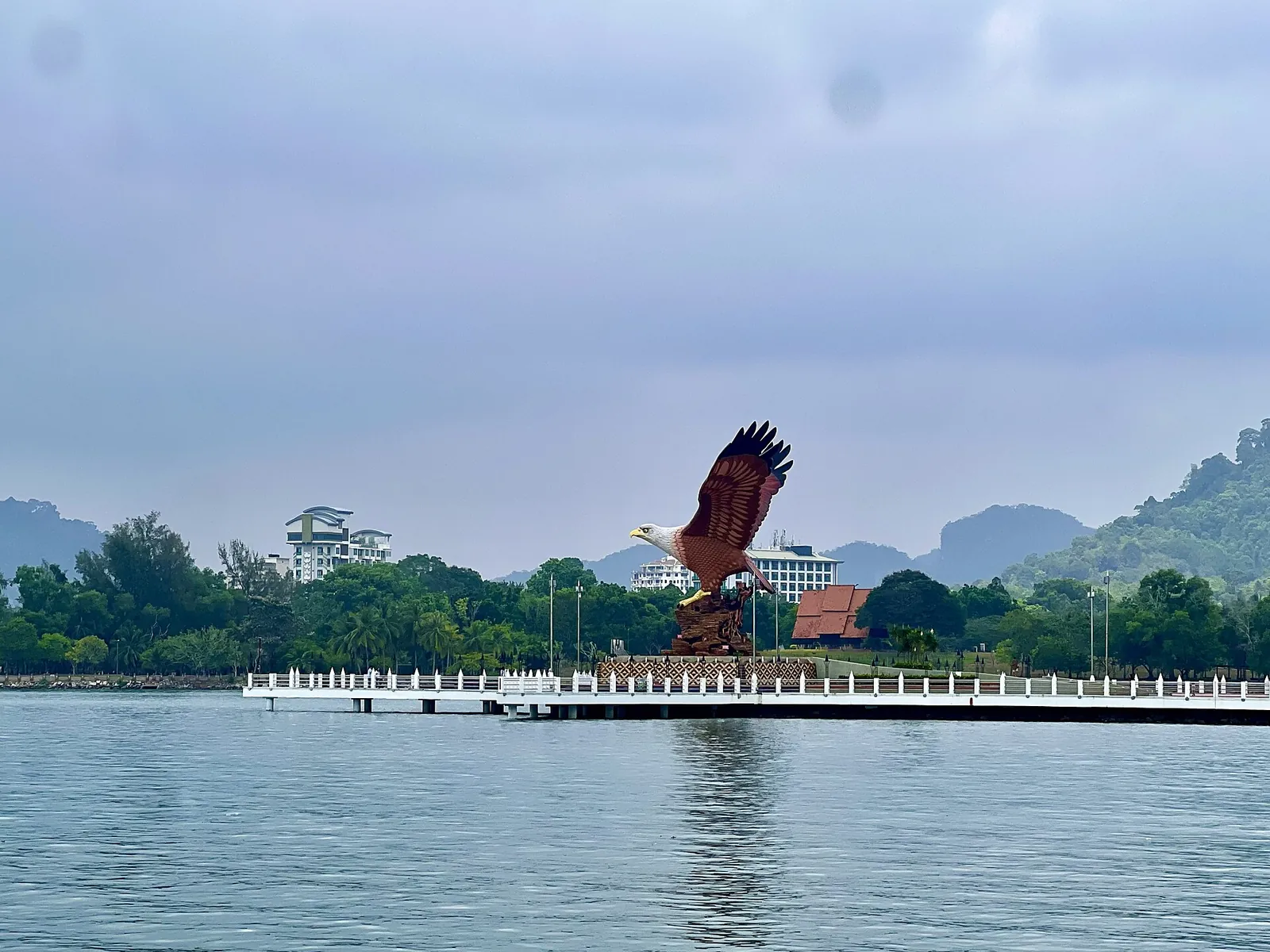 Large eagle sculpture at Dataran Lang in Langkawi seen across the water