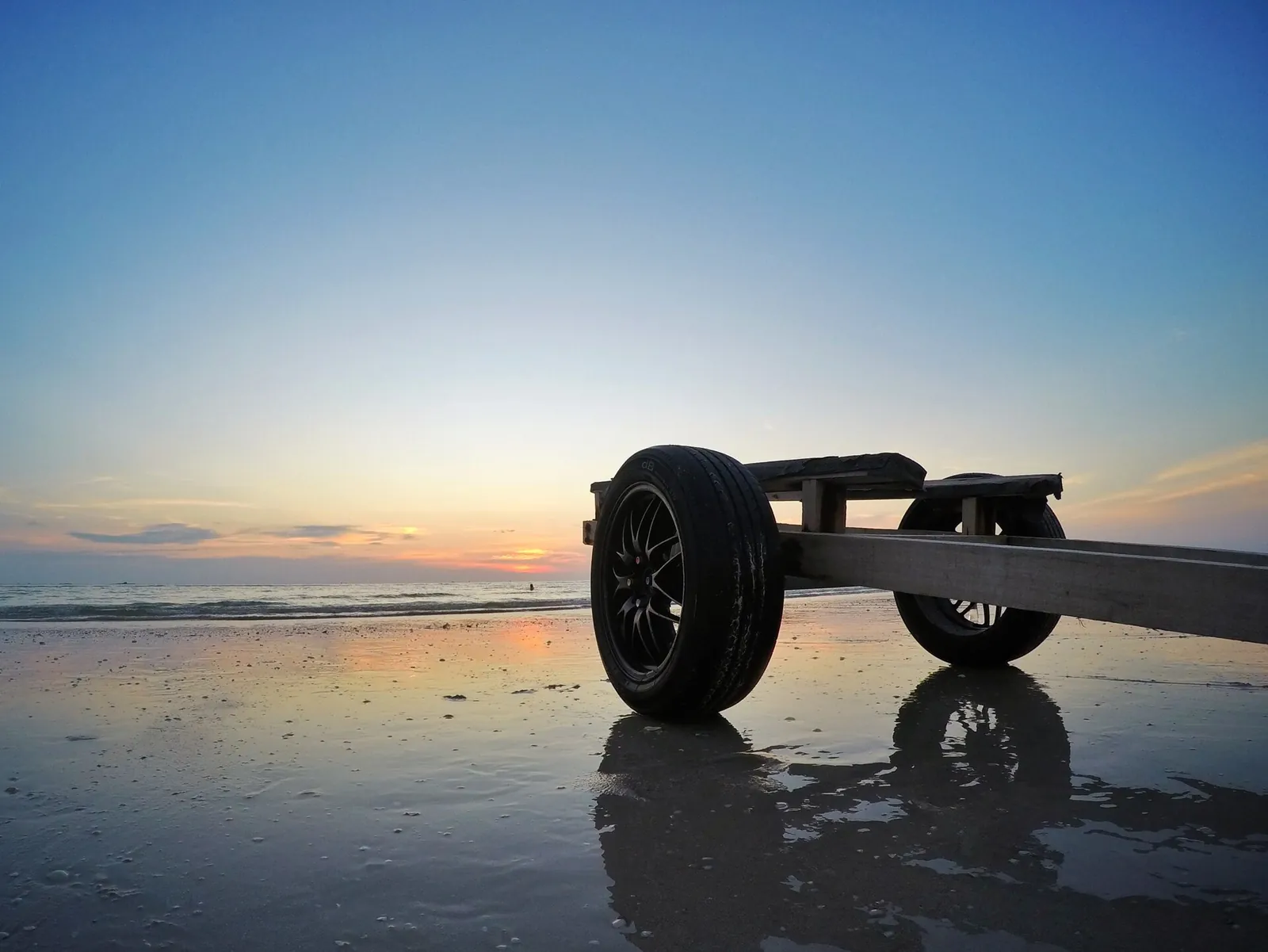 Small vehicle on a Langkawi beach at sunset