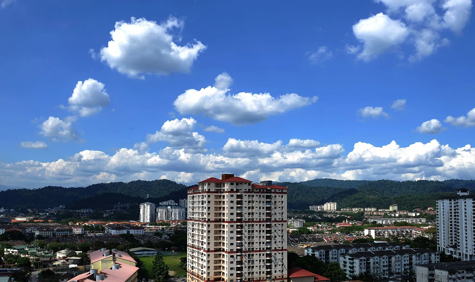 Buildings and hills viewed across Ampang in Kuala Lumpur
