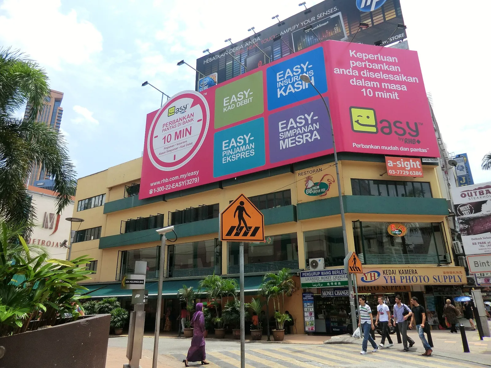 Street crossing signs and shopfronts in Bukit Bintang, Kuala Lumpur