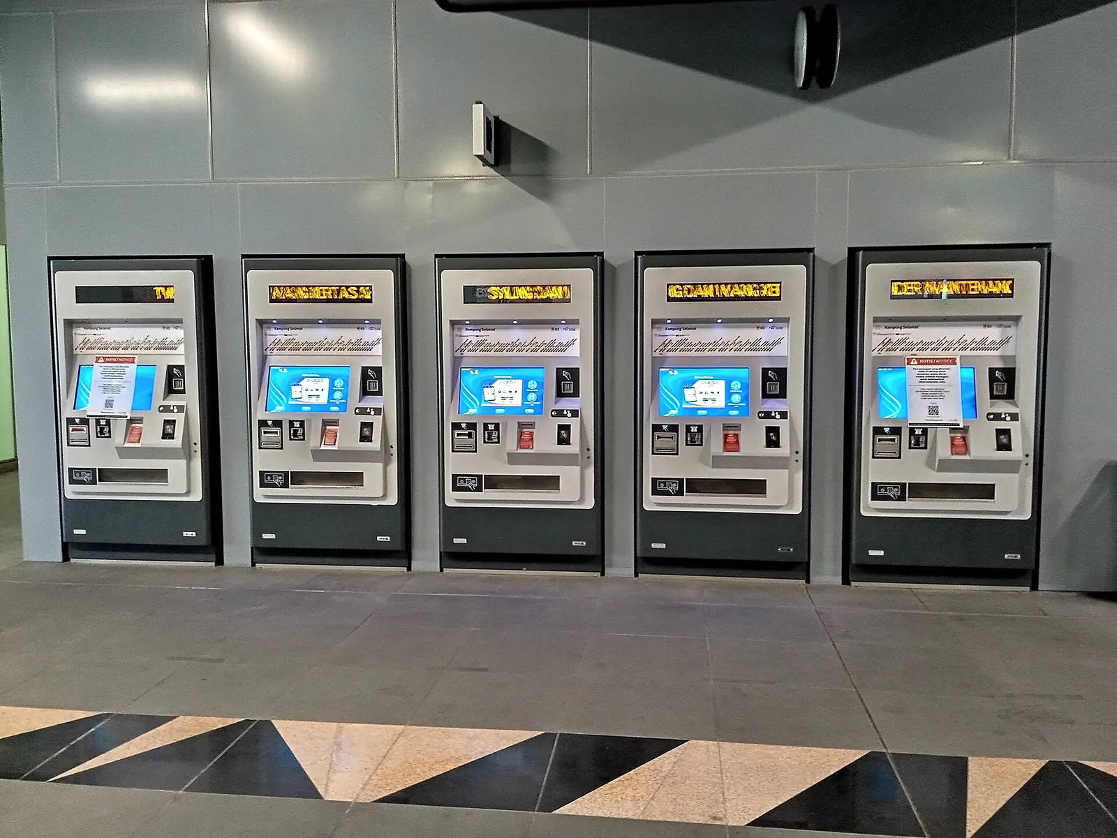 A row of ticket machines in Kampung Selamat MRT station