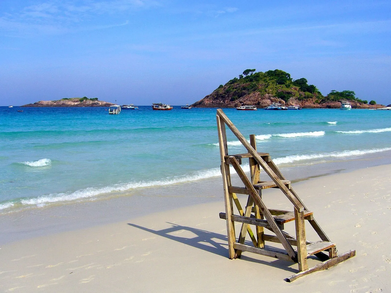 Wooden beach steps beside pale sand and turquoise water at Pasir Panjang on Redang