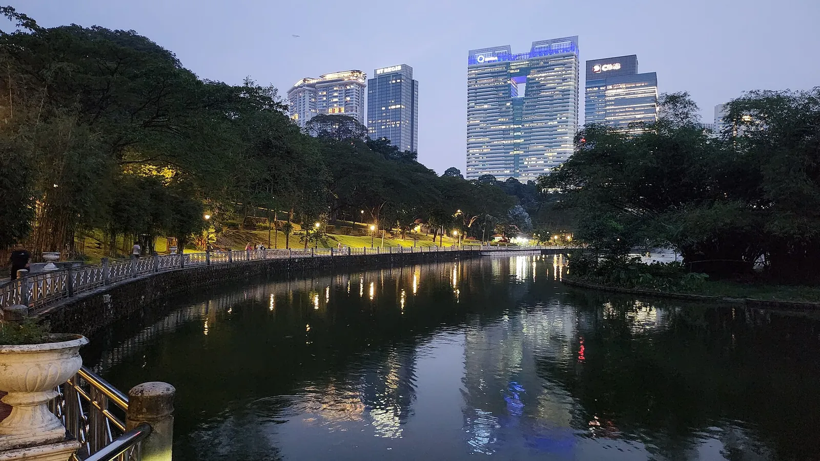 Lake and trees in Kuala Lumpur Botanical Garden at dusk