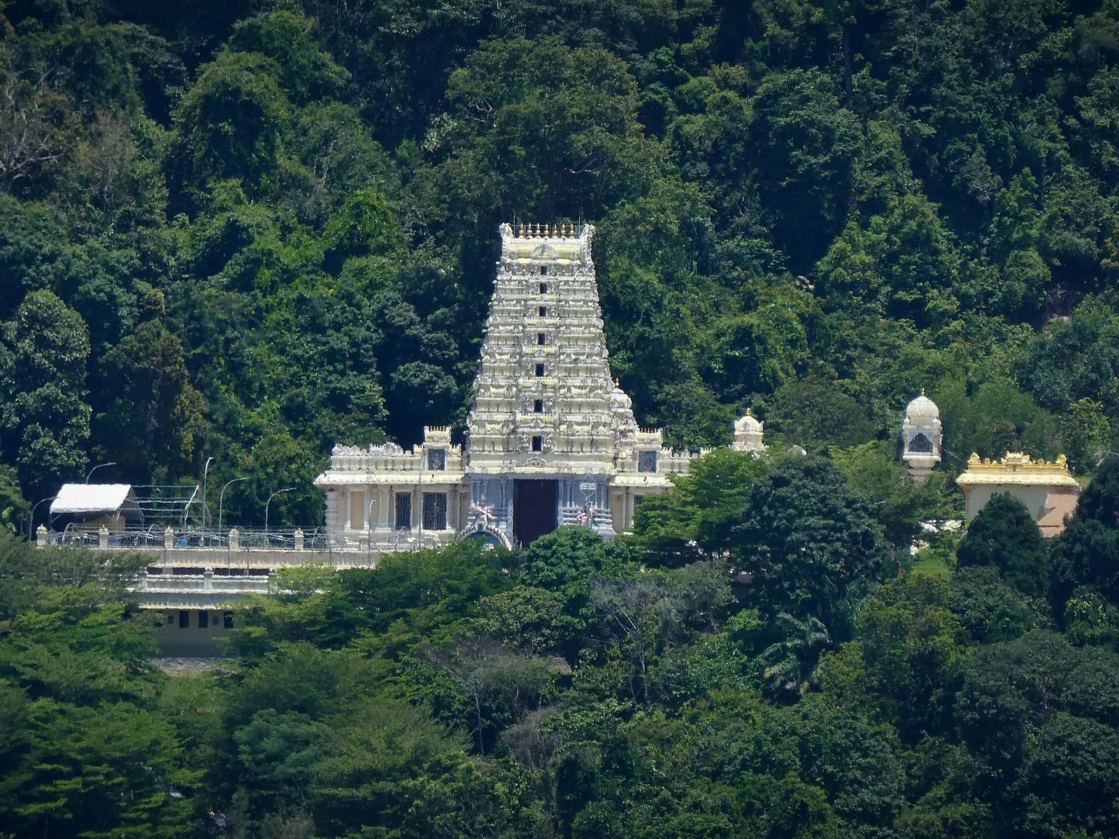 White Waterfall Hilltop Temple surrounded by forest in George Town